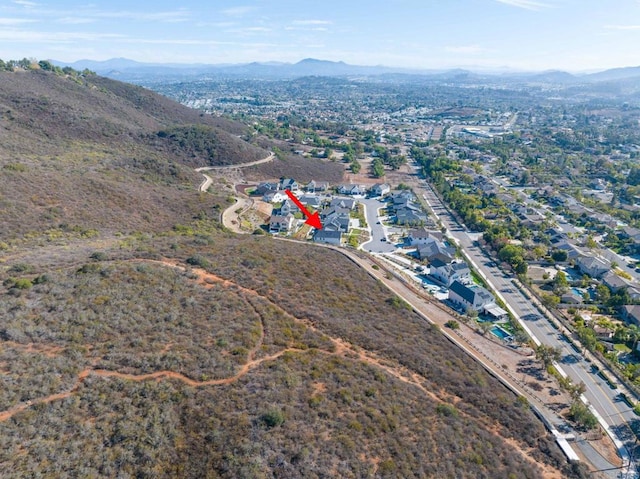 birds eye view of property with a mountain view