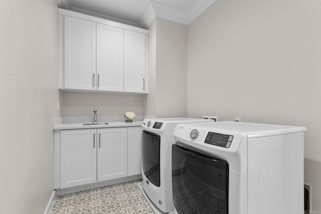 laundry room with cabinets, sink, independent washer and dryer, and light tile patterned floors