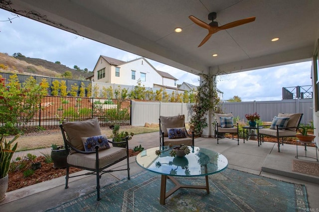 view of patio featuring an outdoor living space and ceiling fan