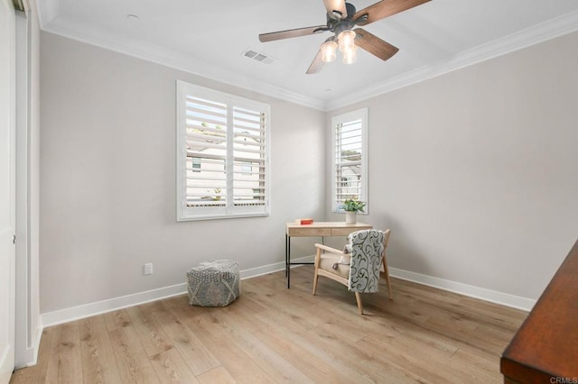 office with ornamental molding, ceiling fan, and light wood-type flooring