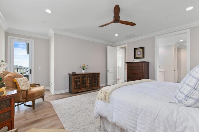 bedroom featuring ornamental molding, connected bathroom, and light wood-type flooring