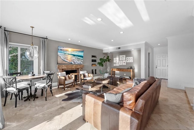 living room featuring crown molding and a chandelier