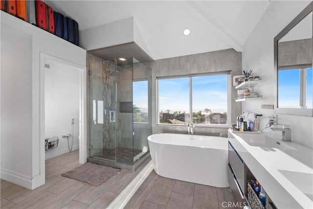 bathroom with vanity and independent shower and bath