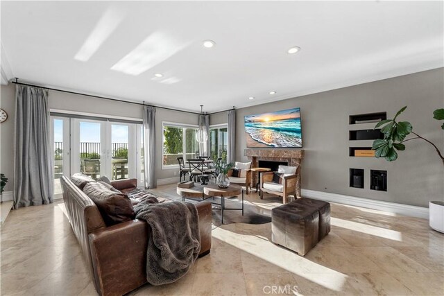 living room with crown molding and french doors