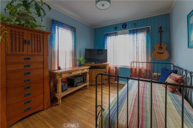 bedroom with wood finished floors