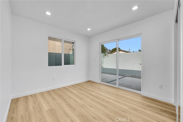 unfurnished room featuring light hardwood / wood-style floors