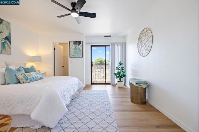 bedroom featuring access to exterior, ceiling fan, and light hardwood / wood-style flooring