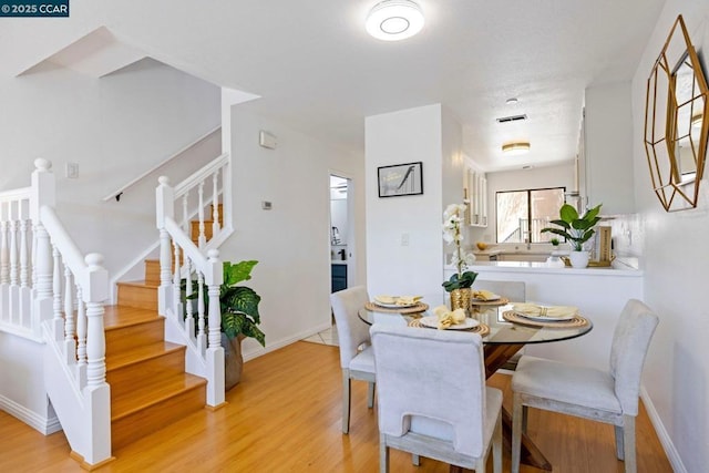 dining room with light hardwood / wood-style floors