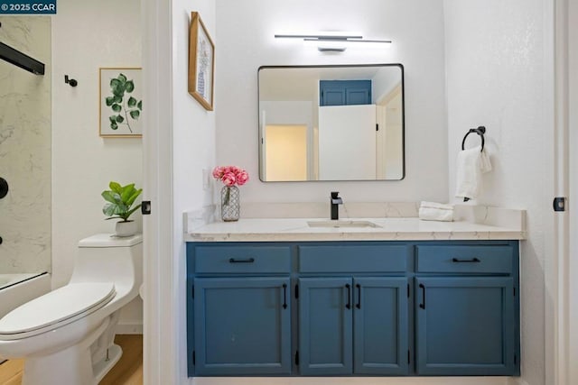 full bathroom with vanity, washtub / shower combination, and toilet