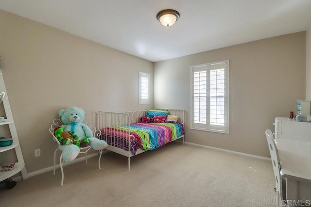 bedroom featuring light colored carpet