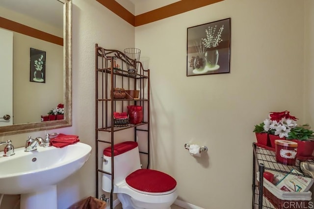 bathroom with sink and toilet