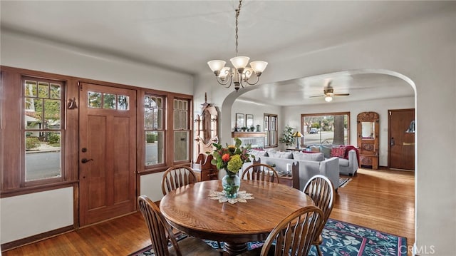 dining area with a notable chandelier and hardwood / wood-style flooring