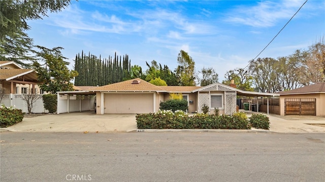 single story home with a carport and a garage