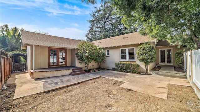 rear view of house with a patio and french doors