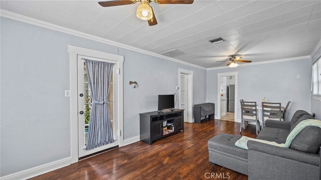 living room featuring dark wood-type flooring, ceiling fan, and crown molding