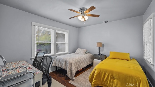 bedroom featuring hardwood / wood-style flooring and ceiling fan