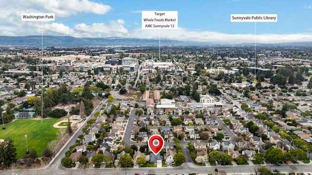 birds eye view of property featuring a mountain view