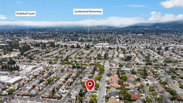 birds eye view of property with a mountain view