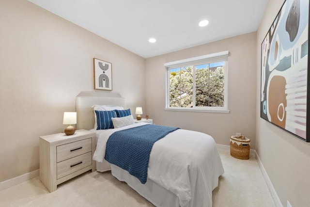 bedroom featuring light colored carpet