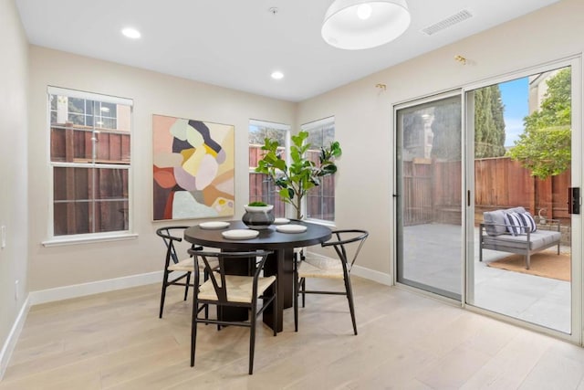 dining room with light wood-type flooring