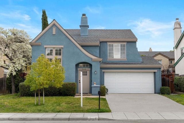 view of front facade featuring a garage and a front lawn