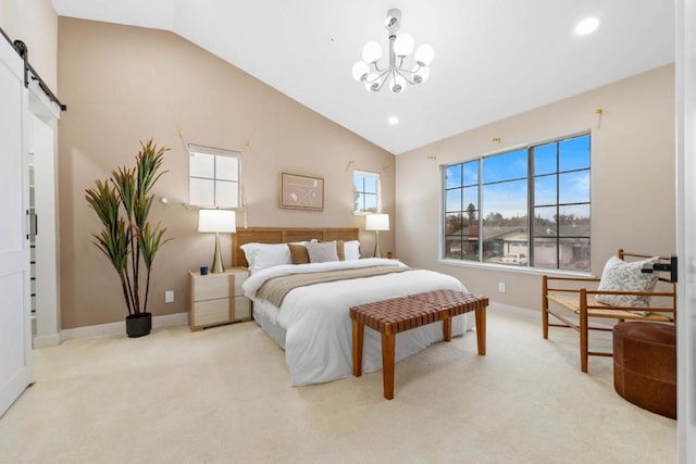 bedroom with multiple windows, vaulted ceiling, light colored carpet, and a barn door