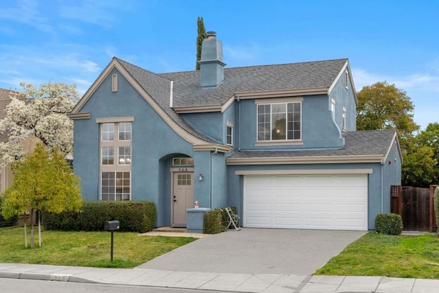 view of front of house featuring a garage and a front yard