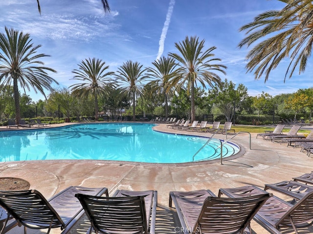 view of swimming pool featuring a patio area