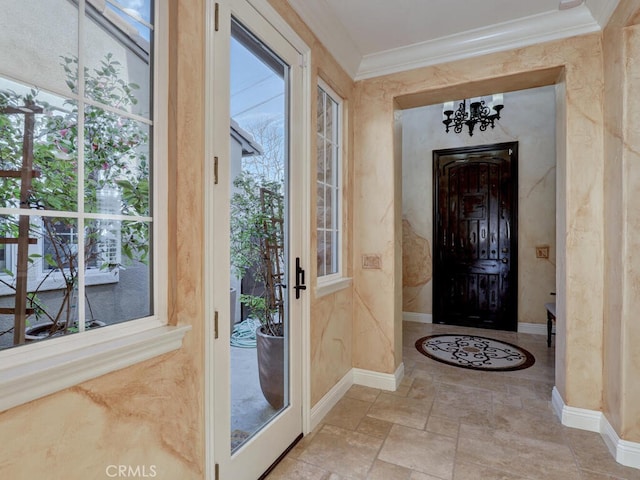 entryway featuring crown molding and a wealth of natural light