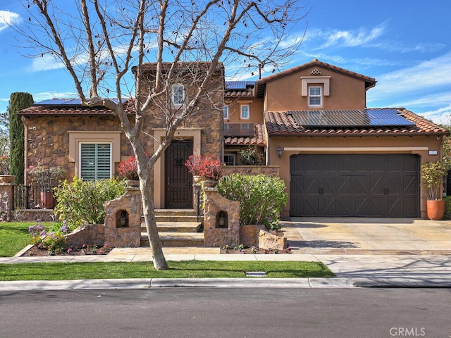 mediterranean / spanish-style home featuring solar panels