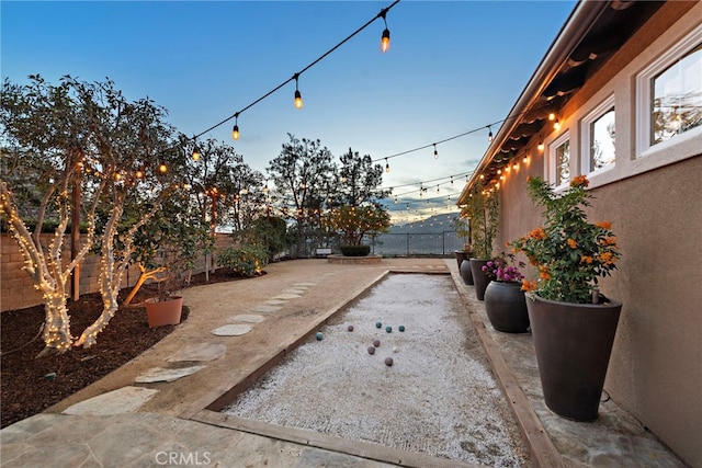 view of patio terrace at dusk