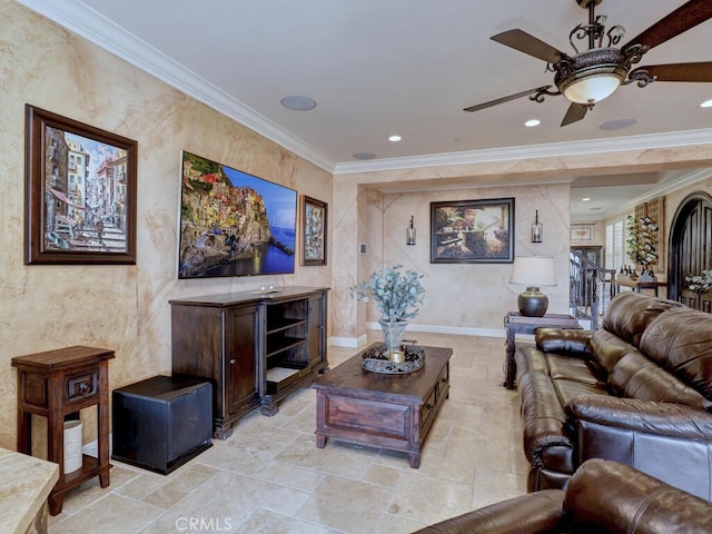 living room with ornamental molding and ceiling fan