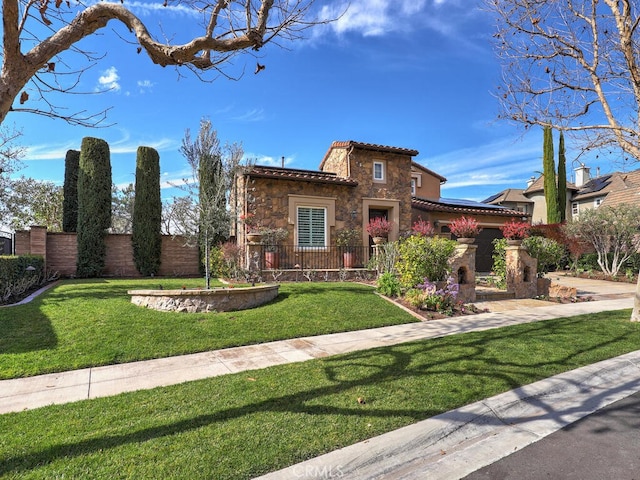 mediterranean / spanish-style house with a front lawn