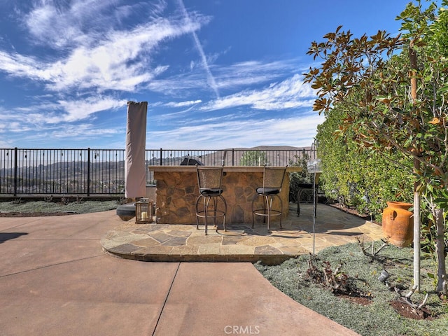 view of patio with a bar