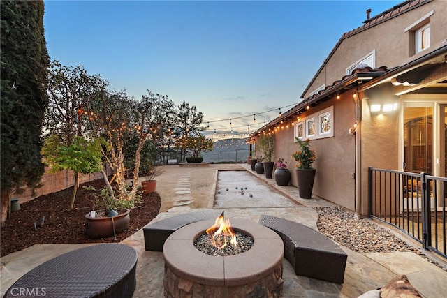 patio terrace at dusk with a fire pit