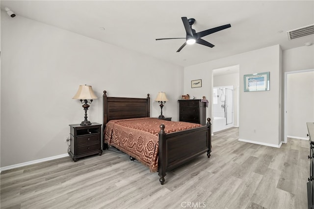 bedroom featuring visible vents, baseboards, and light wood finished floors