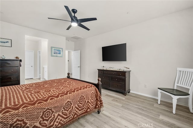 bedroom with visible vents, light wood-style floors, baseboards, and ceiling fan