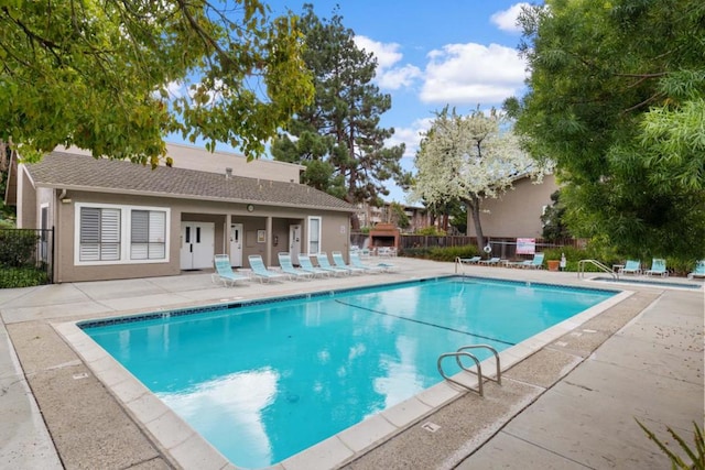 view of swimming pool featuring a patio area