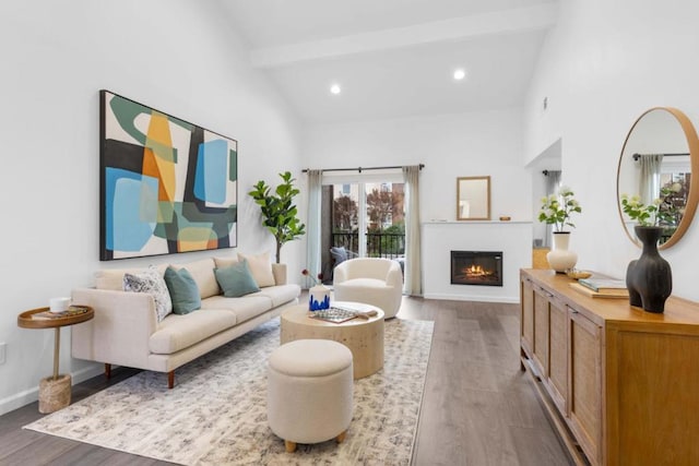 living room with beamed ceiling, wood-type flooring, and high vaulted ceiling