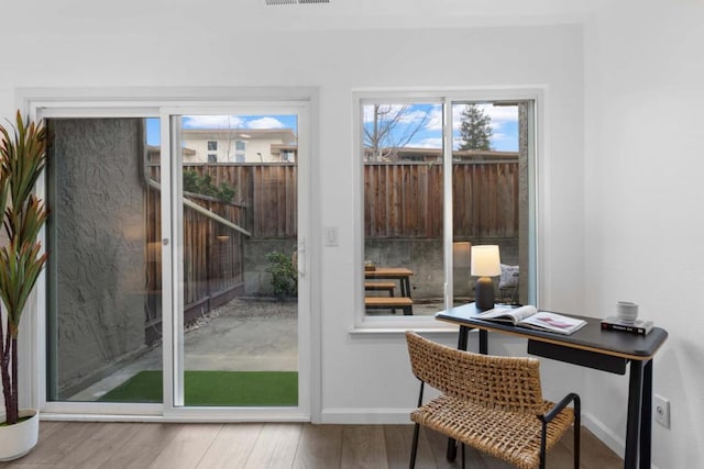 doorway with hardwood / wood-style floors