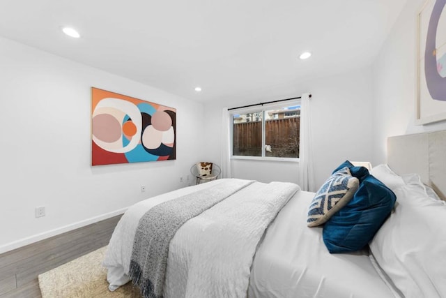 bedroom with hardwood / wood-style floors