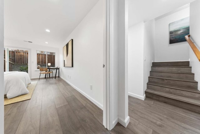 corridor featuring wood-type flooring