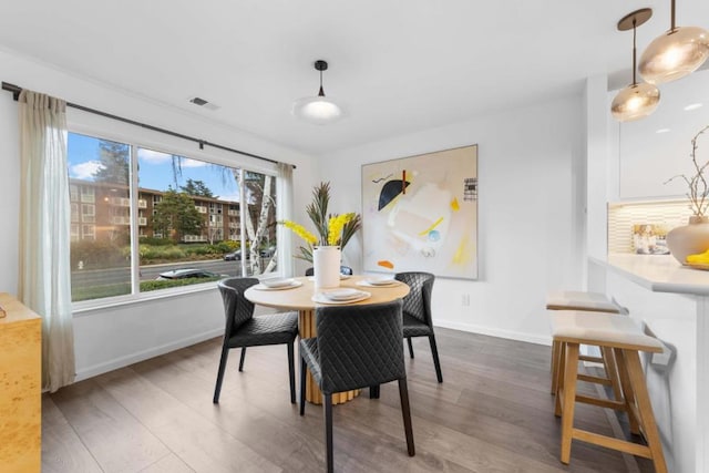 dining area featuring dark hardwood / wood-style floors