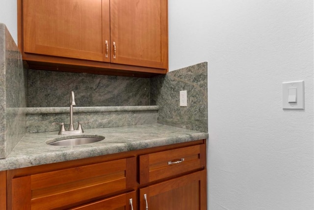 kitchen featuring sink and decorative backsplash