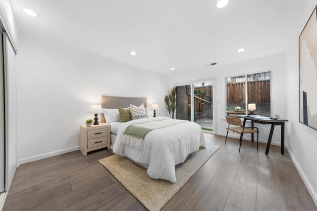 bedroom with hardwood / wood-style flooring and access to outside