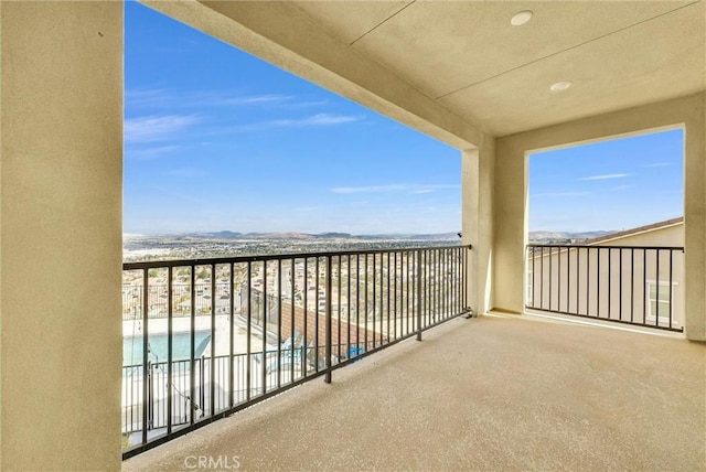 balcony with a view of the beach and a water view