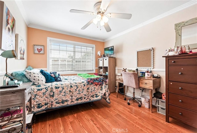 bedroom with crown molding, ceiling fan, and light hardwood / wood-style flooring