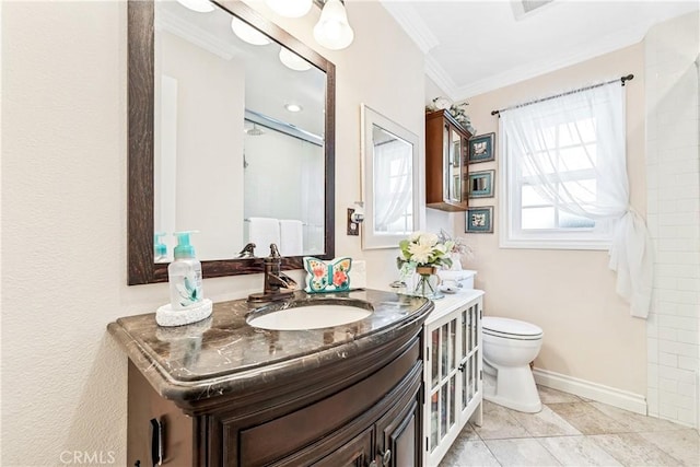 bathroom featuring a shower with shower door, vanity, crown molding, tile patterned flooring, and toilet