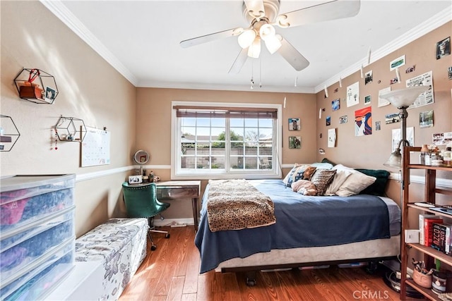 bedroom featuring ornamental molding, hardwood / wood-style flooring, and ceiling fan