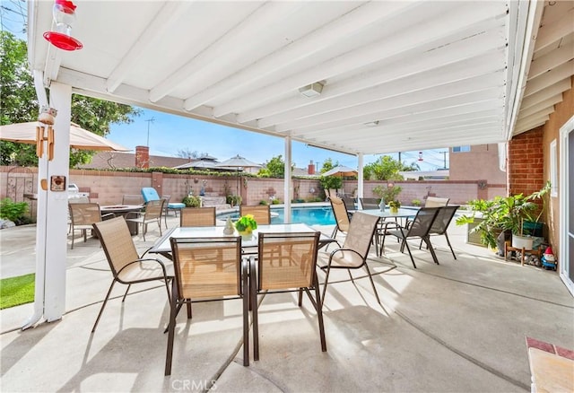 view of patio / terrace featuring a fenced in pool